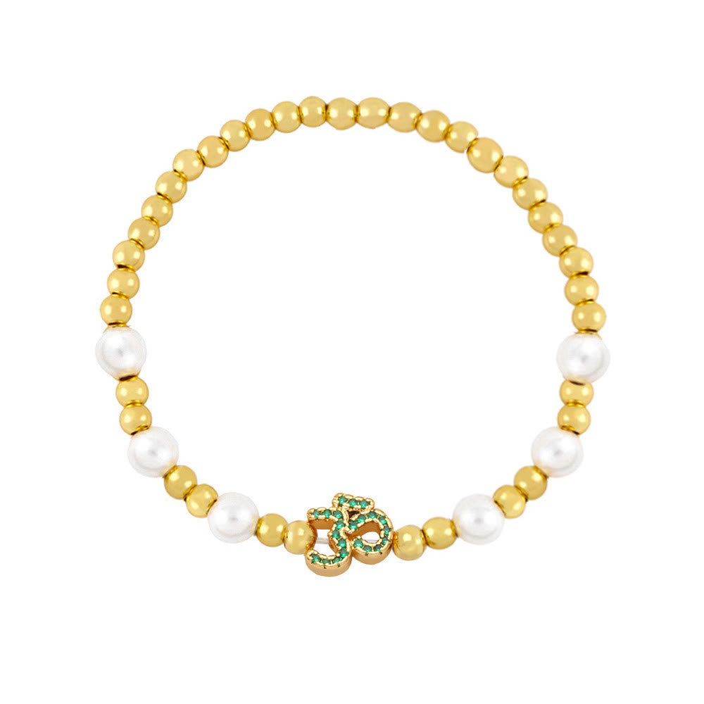 Bracciale Olivenorma in ottone con perle e simbolo Om