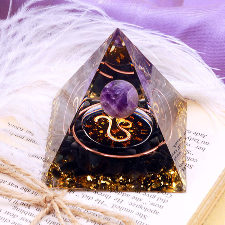 Sfera di ametista Olivenorma con piramide di orgone dello zodiaco Leone in ossidiana 