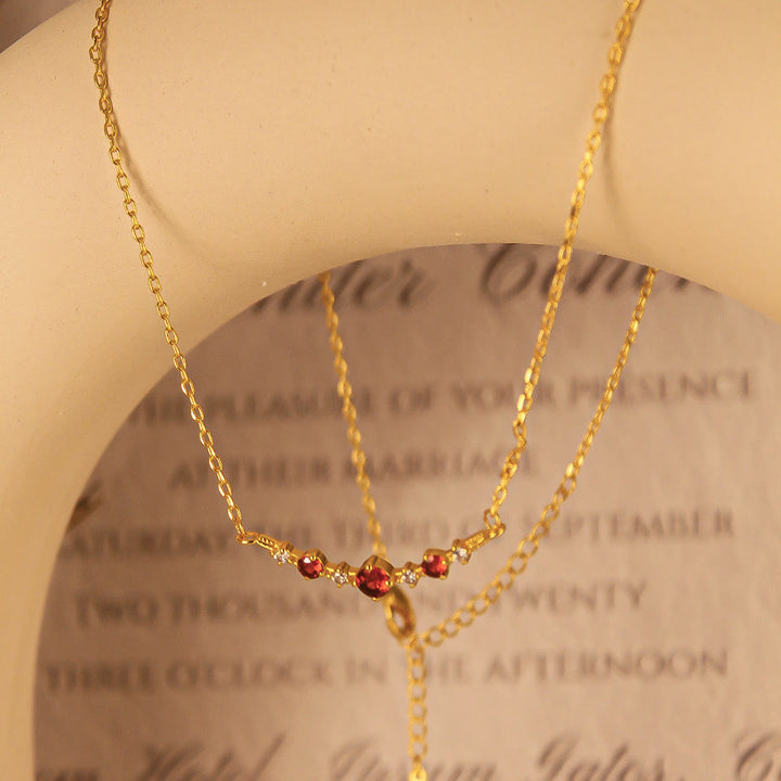 Collana Olivenorma "Simbolo dell'Indipendenza" con granato e diamanti