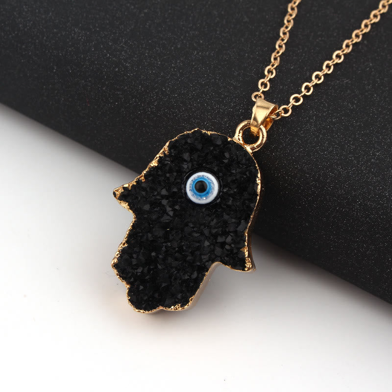Collana di cristallo trasparente di ossidiana con occhio maligno di Hamsa Olivenorma