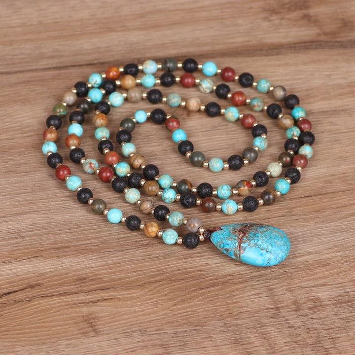 Collana di perline Mala con ciondolo a forma di goccia turchese Olivenorma
