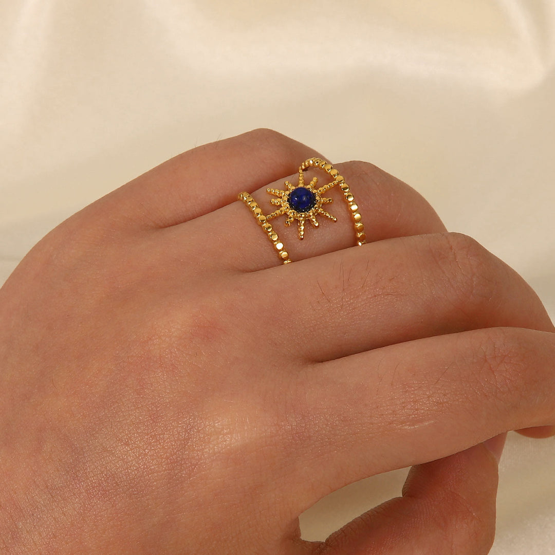 Anello con gemma a forma di stella a otto punte e doppia fila di girasole Olivenorma