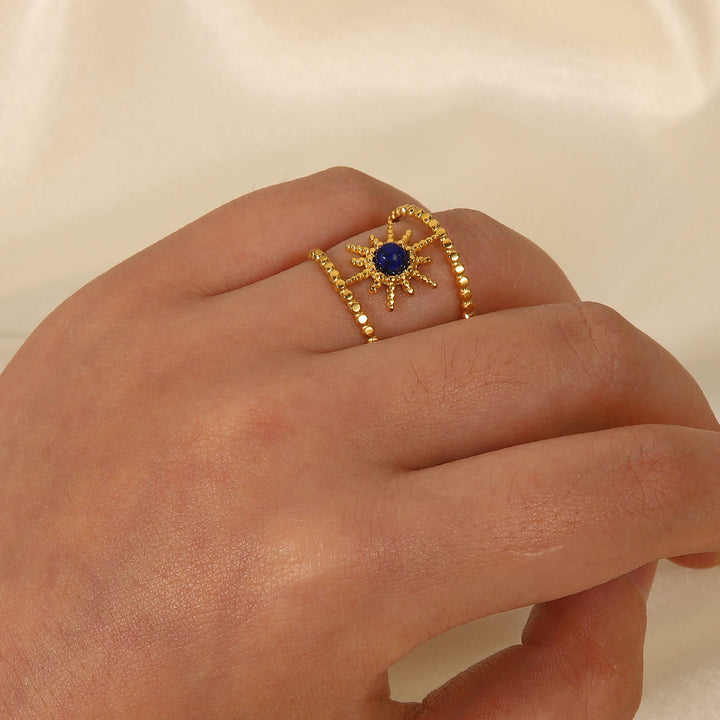 Anello con gemma a forma di stella a otto punte e doppia fila di girasole Olivenorma