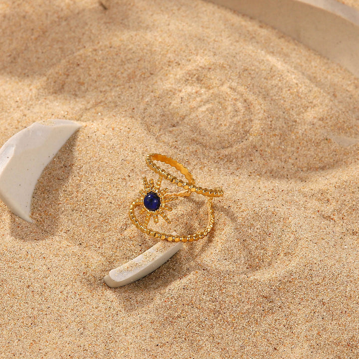 Anello con gemma a forma di stella a otto punte e doppia fila di girasole Olivenorma