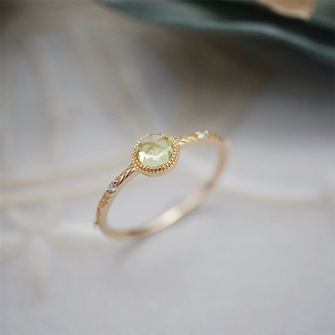 Anello Olivenorma con peridoto verde taglio rotondo naturale