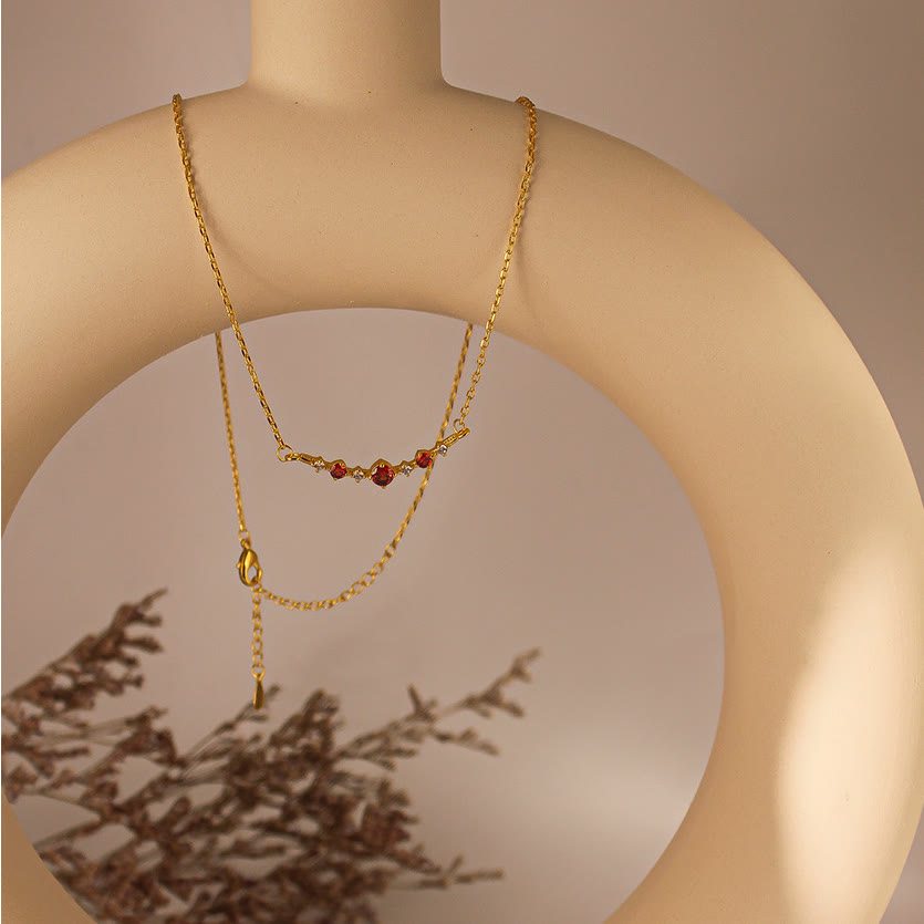 Collana Olivenorma "Simbolo dell'Indipendenza" con granato e diamanti