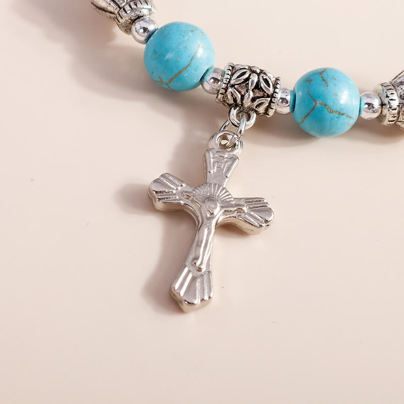 Bracciale con ciondolo a croce con perline turchesi Olivenorma