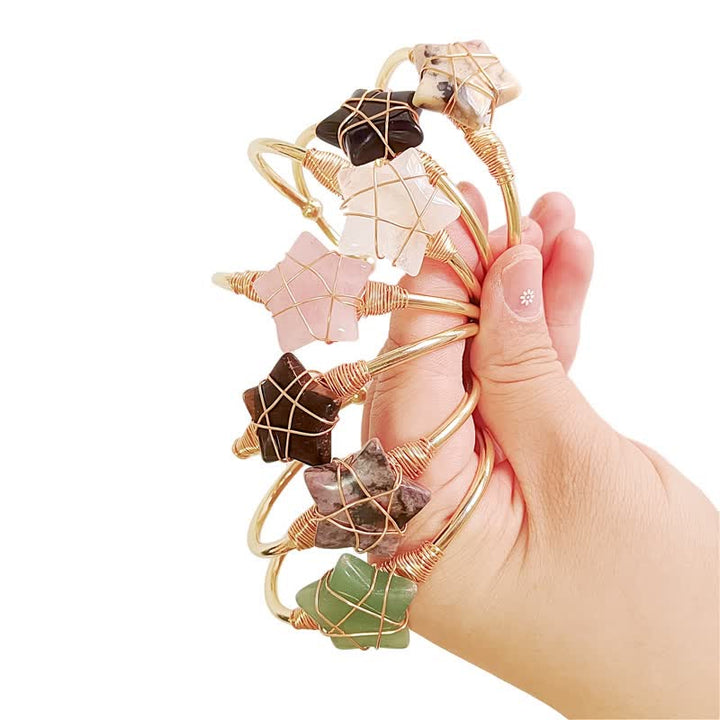 Bracciale Olivenorma con pietre preziose a forma di stella avvolte in filo d'oro