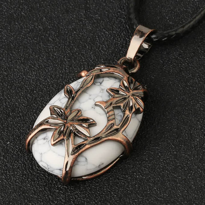 Collana con fiore in ottone e ametista Olivenorma avvolto in cristallo