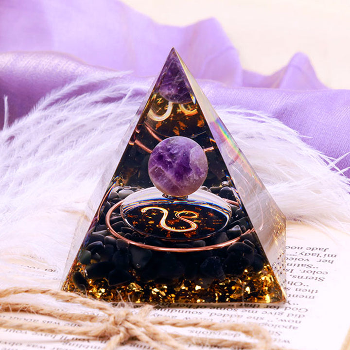 Sfera di ametista Olivenorma con piramide di orgone dello zodiaco Leone in ossidiana 