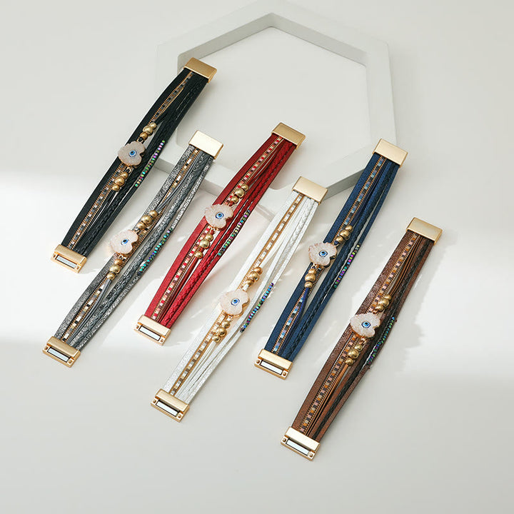 Olivenorma "Tripla protezione" Braccialetto con perline dorate e cristallo a forma di cuore contro il malocchio