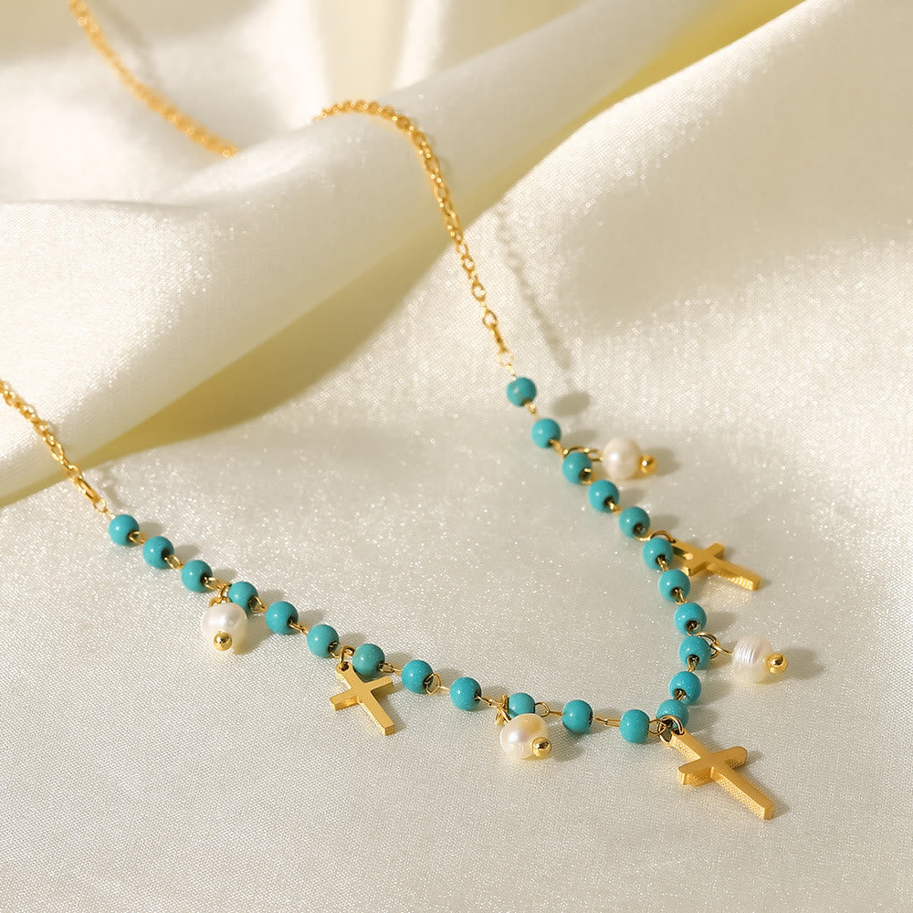 Collana con ciondolo a croce con perle turchesi Olivenorma e nappa