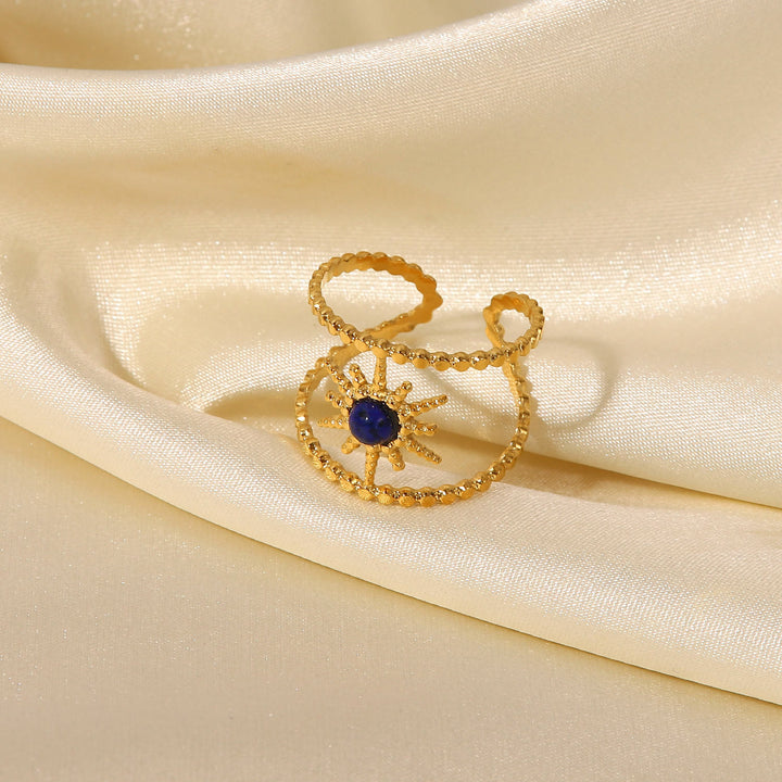 Anello con gemma a forma di stella a otto punte e doppia fila di girasole Olivenorma