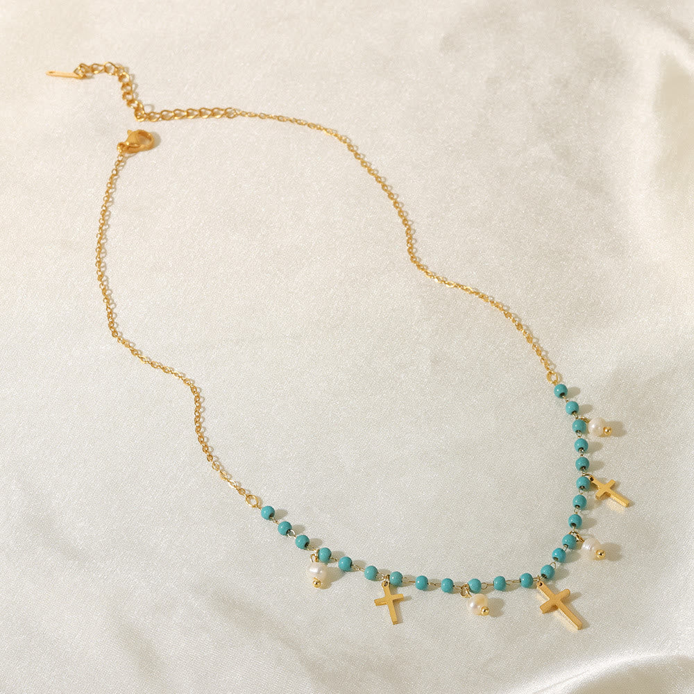 Collana con ciondolo a croce con perle turchesi Olivenorma e nappa