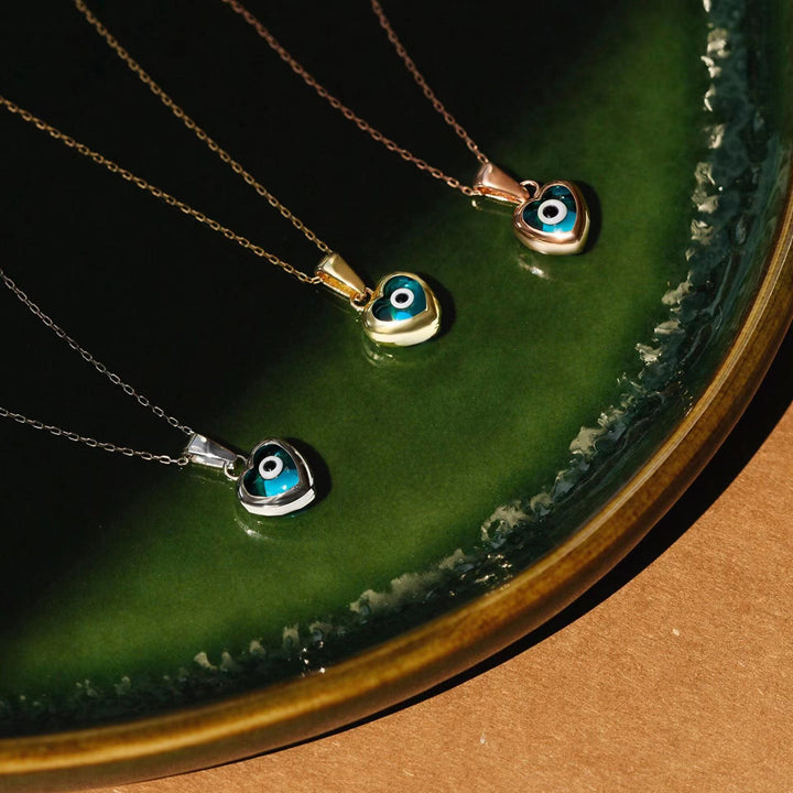 Collana in acciaio e titanio con occhio maligno e topazio blu Olivenorma 