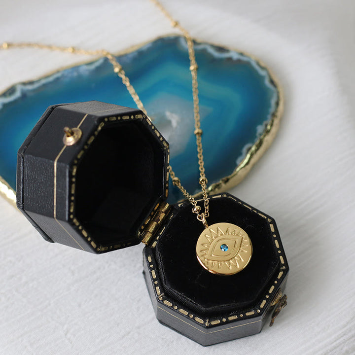 Collana in acciaio al titanio 316L con topazio blu e malocchio Olivenorma 