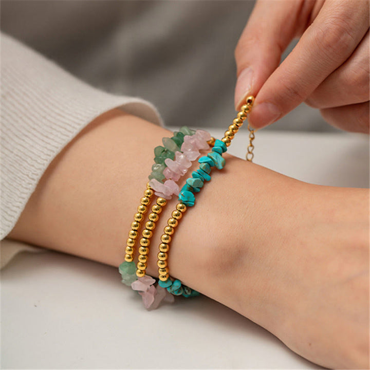 Bracciale Olivenorma con perline dorate in cristalli naturali frantumati