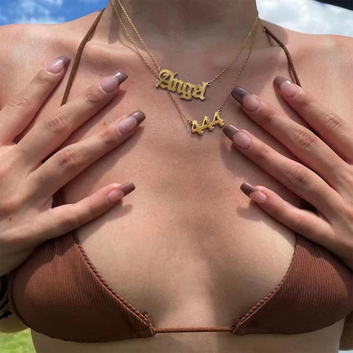 Collana doppia delicata con numero angolare e angelo Olivenorma 