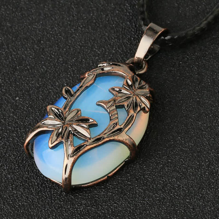 Collana con fiore in ottone e ametista Olivenorma avvolto in cristallo