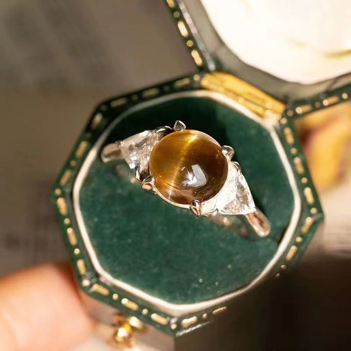 Anello Olivenorma con pietra occhio di gatto verde dorato a quattro artigli