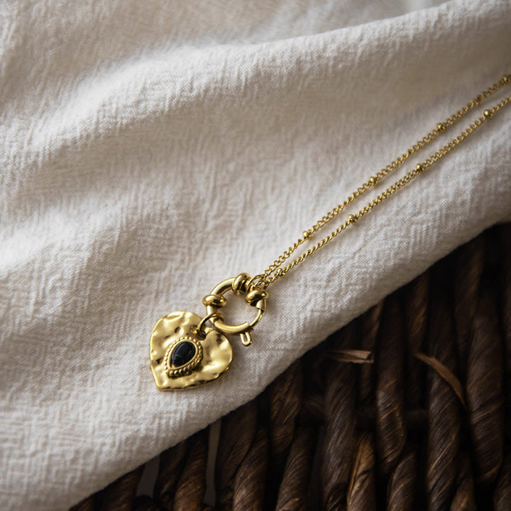 Collana con ciondolo in acciaio al titanio con cuore turchese nero Olivenorma 