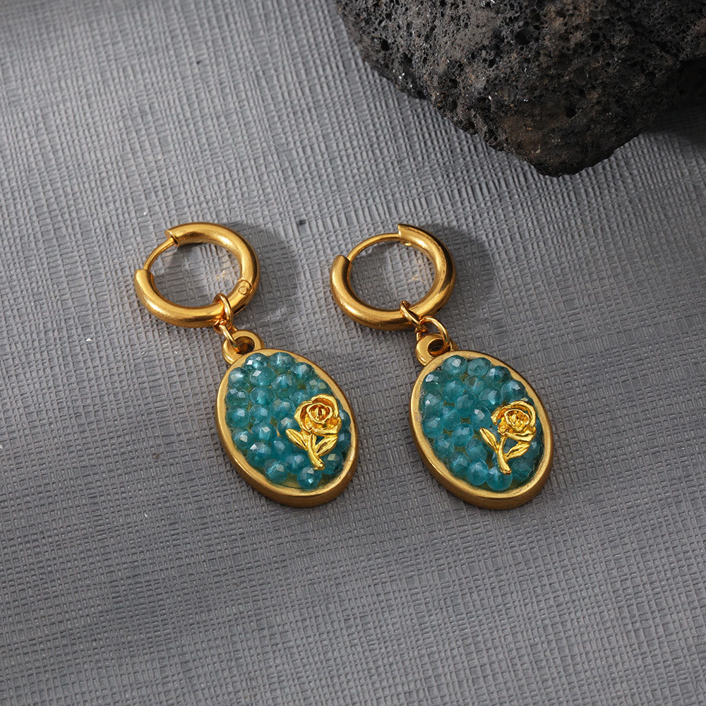 Orecchini pendenti ovali in tormalina Paraiba Olivenorma con rosa schiacciata 