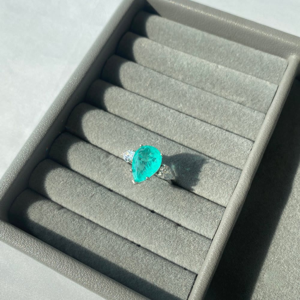 Anello squisito con tormalina Paraiba Olivenorma e zircone bianco