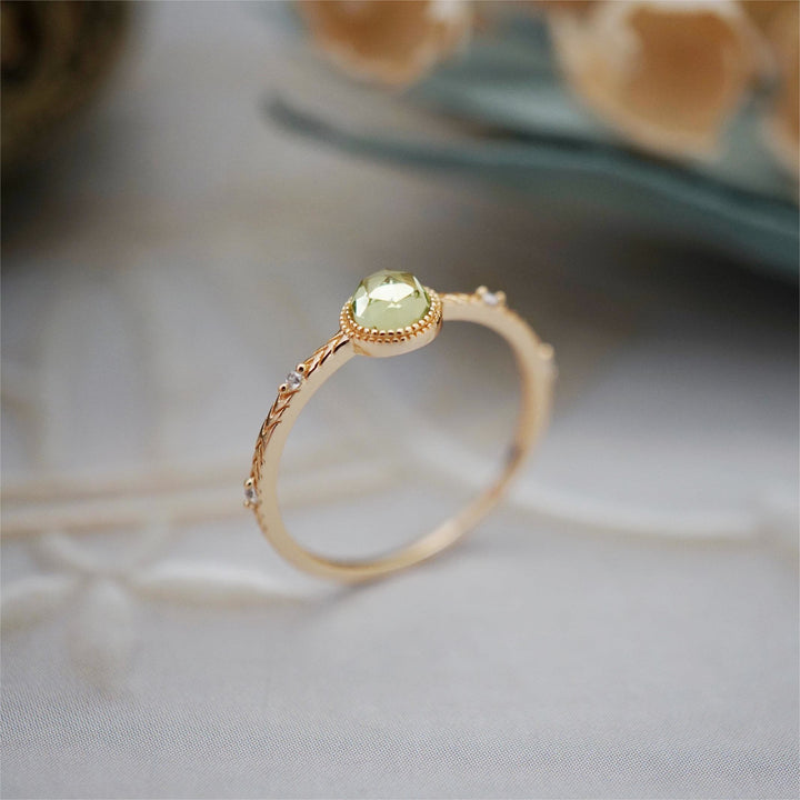 Anello Olivenorma con peridoto verde taglio rotondo naturale